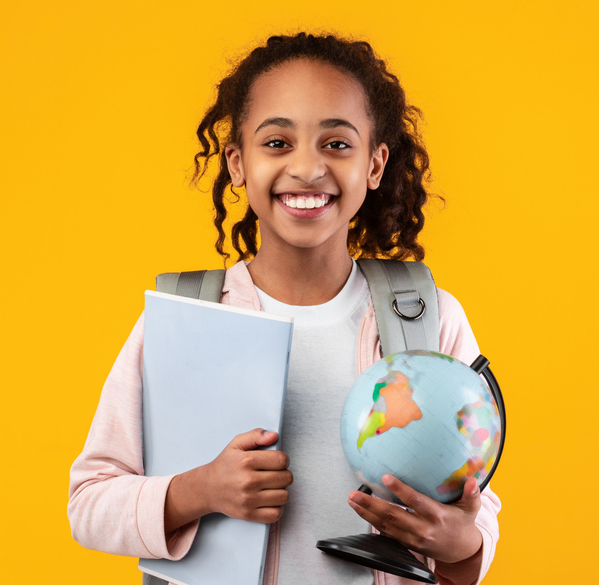 girl holding globe and laptop